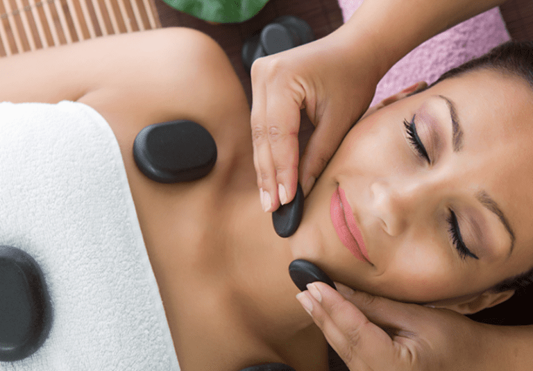 woman getting a hot stone massage